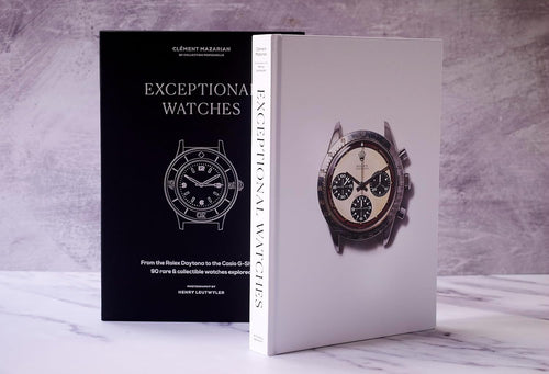 Book titled 'Exceptional Watches' with images of watches on a marble surface.
