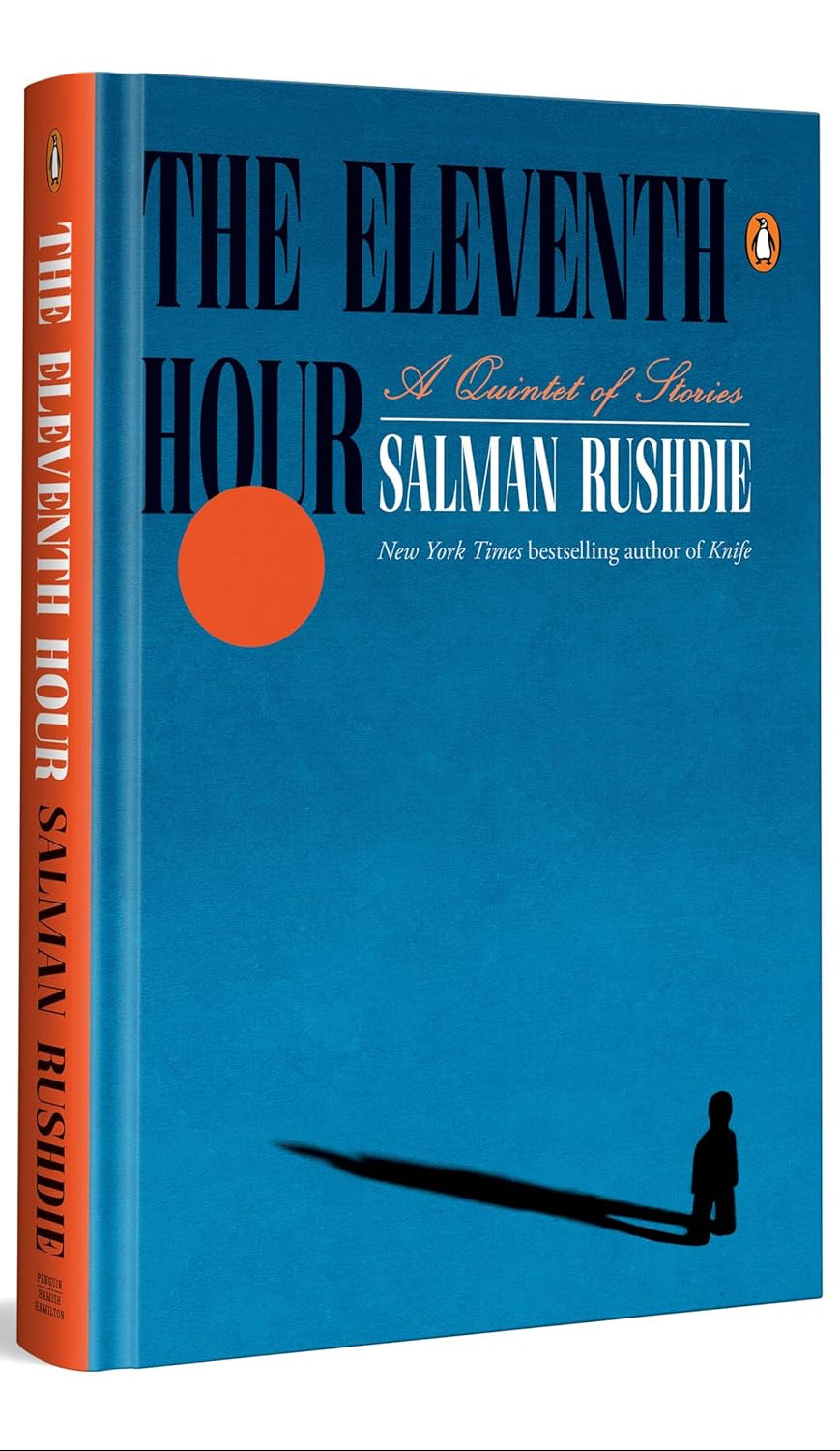 Book cover of 'The Eleventh Hour' by Salman Rushdie with a blue background and orange spine.
